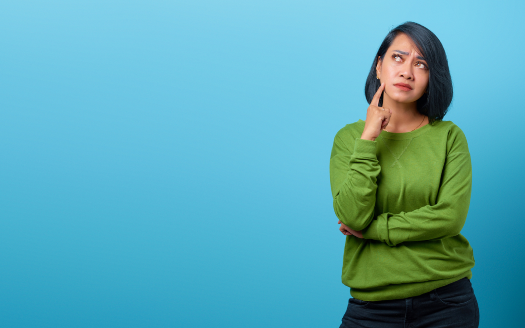An attractive Asian woman looking pensive